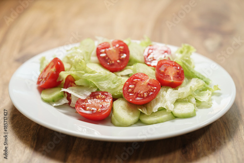 vegetable salad with tomato, cucumber and iceberg lettuce