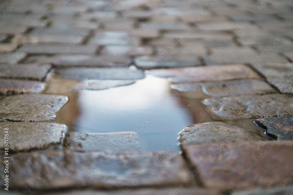 puddle on old stone pavement background puddle on old stone pavement background