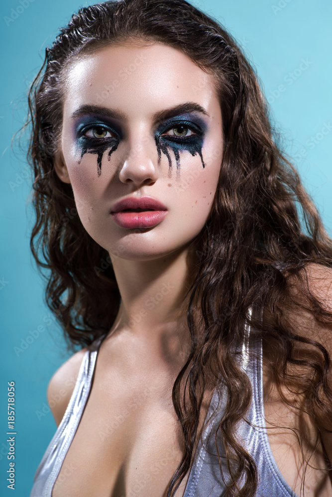 Portrait of beautiful woman with aggressive makeup looking at camera Stock  Photo | Adobe Stock