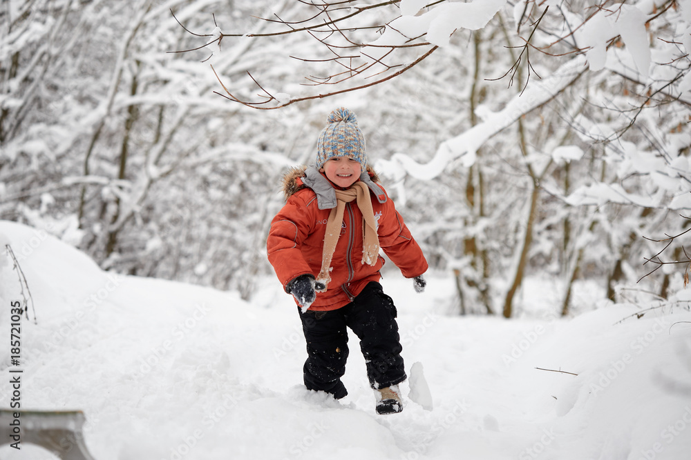 a boy in a knitted winter hat.