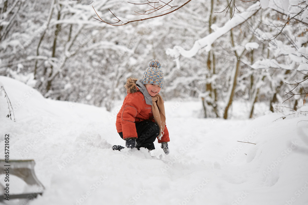 a boy in a knitted winter hat.