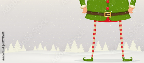 Christmas composition of feet and hands of Elf standing in the snow . Festive New Year background.