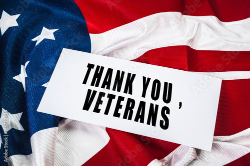 Veterans day greeting card on flag