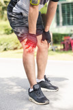 Asian young sport man knee injury from jogging