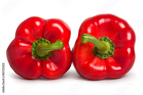 Two red sweet peppers isolated