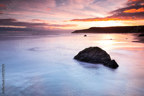 A calm beach in North Yorkshire at dawn
