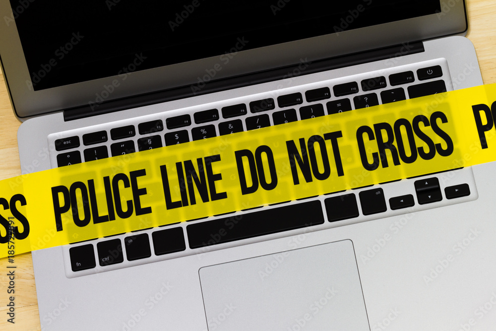 Crime scene marked with police tape Crime scene marked with police tape