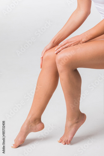 Beautiful woman touching legs
