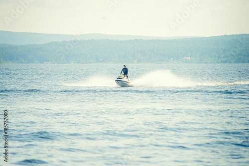Dona Paula, Goa, India - February 15, 2017: Tourist enjoy water scooter ride in the sea around Dona Paula in Goa, India.