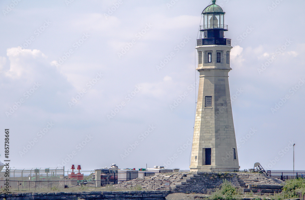 Exterior daytime stock photo of Buffalo Main Lighthouse at the mouth of the Buffalo River and Erie Canal taken from Erie Basin Marina in Buffalo New York Erie County