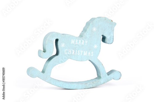 Wooden small toy horse on a white background. Christmas blue horse on isolation. Symbol, sign of Merry Christmas. Retro toy horse