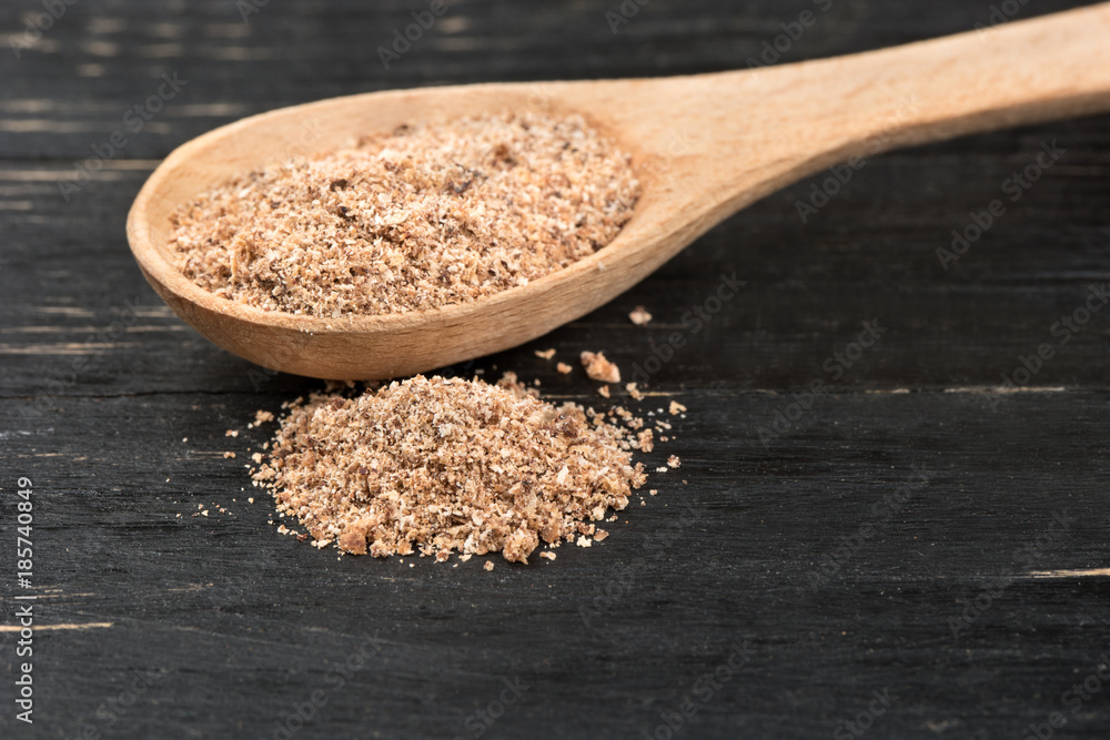 Nutmeg powder in spoon Nutmeg powder in spoon