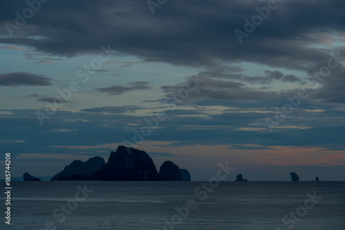 dark gloomy landscape after sunset - view of the sea and rocks