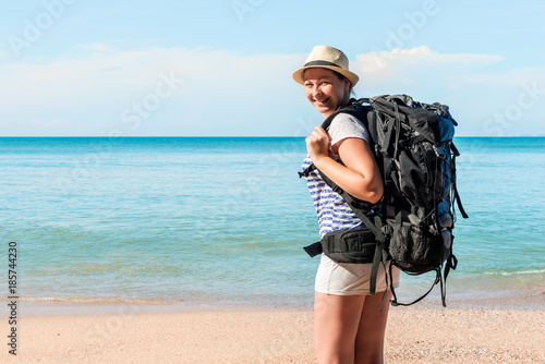 happy woman tourist on the beach on vacation © kosmos111