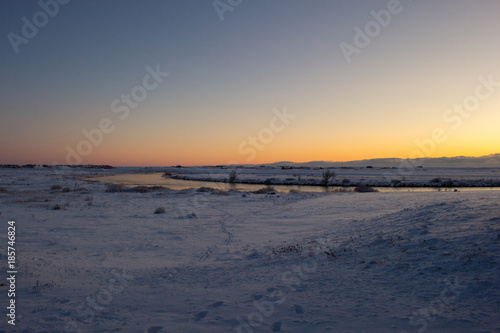 Golden House Sunset over a snowy winter landscape in Hella  Iceland