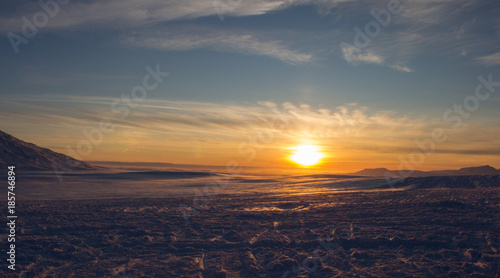 Golden House Sunset over a snowy winter landscape in Hella Iceland © Michelle