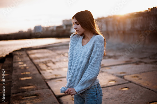 girl in a sweater near the sea