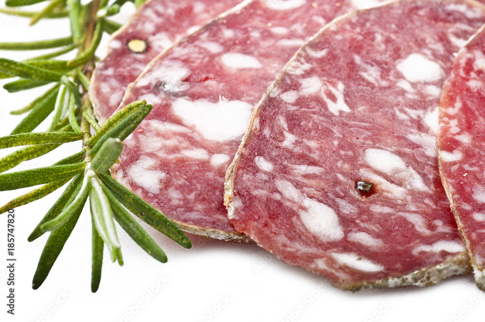 pork salami sliced on a white background