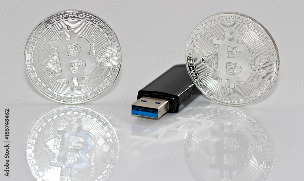 Souvenir silver coins bitcoin and USB flash drive with the information  Stock Photo | Adobe Stock