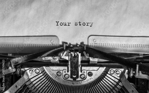 your story typed words on a Vintage Typewriter. Mechanisms closeup. Typing on old typewriter