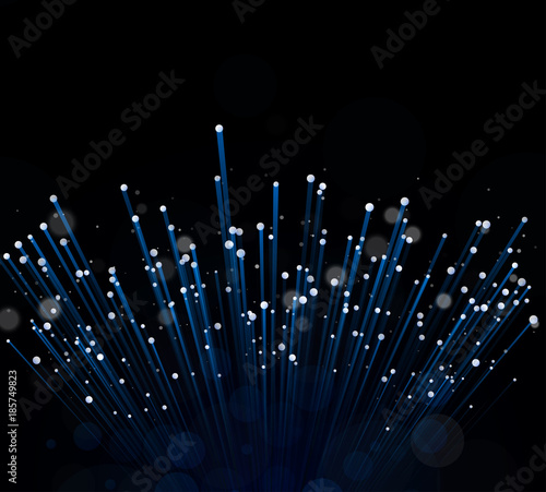 Blue glass fiber with burning ends on a black background. Transfer of information or article about the Internet. Copy space.