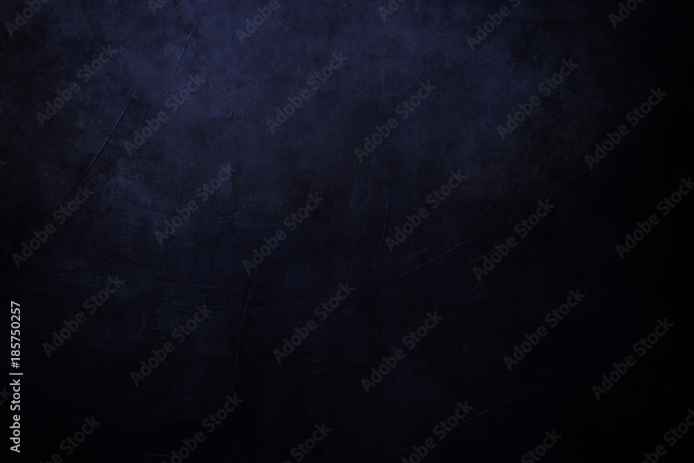 black and blue grungy background with spotlight background