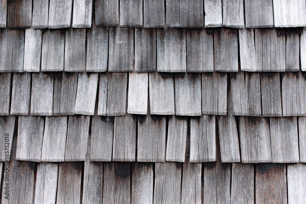Fototapeta premium wooden tiles, detail of the old weathered wooden roof, wooden texture, abstract pattern, wallpaper background