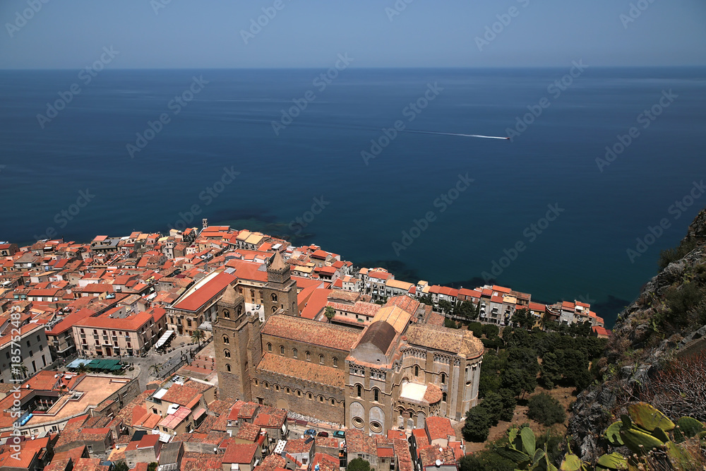 Cefalu, Sicily, Italy. A picturesque view of the city and cathedral of the Transfiguration of the Lord (UNESCO list) from the height of La Rocca