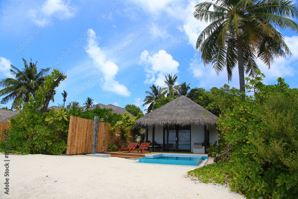 Luxury beach resort, bungalow near endless pool , summer vacation concept