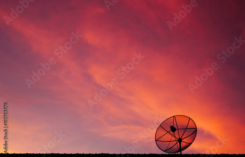 Satellite dish on twilight sky