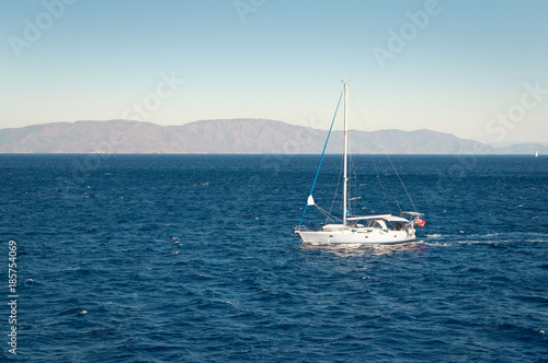 A yacht in the Mediterranean sea on blue sky background