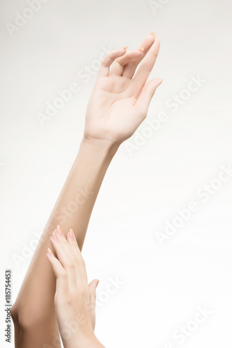 beautiful woman's hands with light pink manicure on the nails