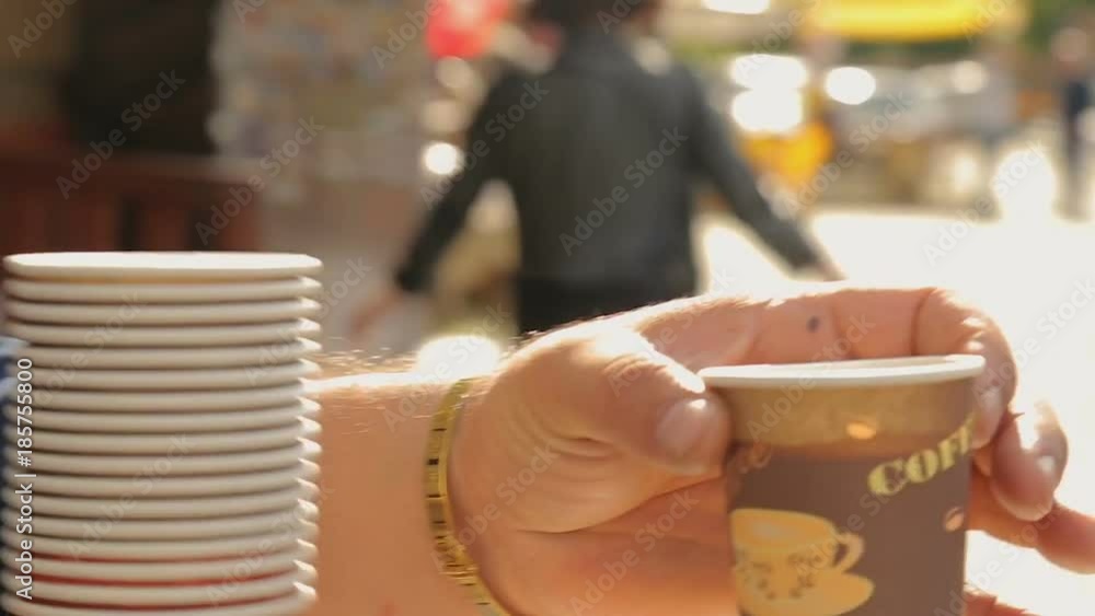 Male selling coffee in the street, small business, national warm hospitality Male selling coffee in the street, small business, national warm hospitality