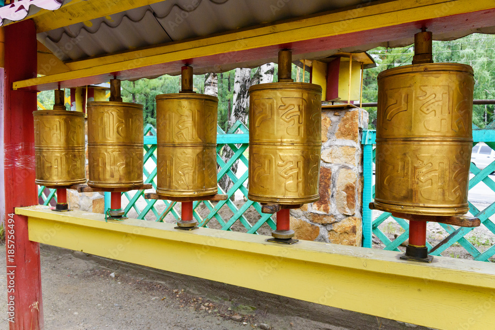 Prayer cylinders in Buddhist datsan Dechen Ravzhalin in Arshan. Russia Prayer cylinders in Buddhist datsan Dechen Ravzhalin in Arshan. Russia