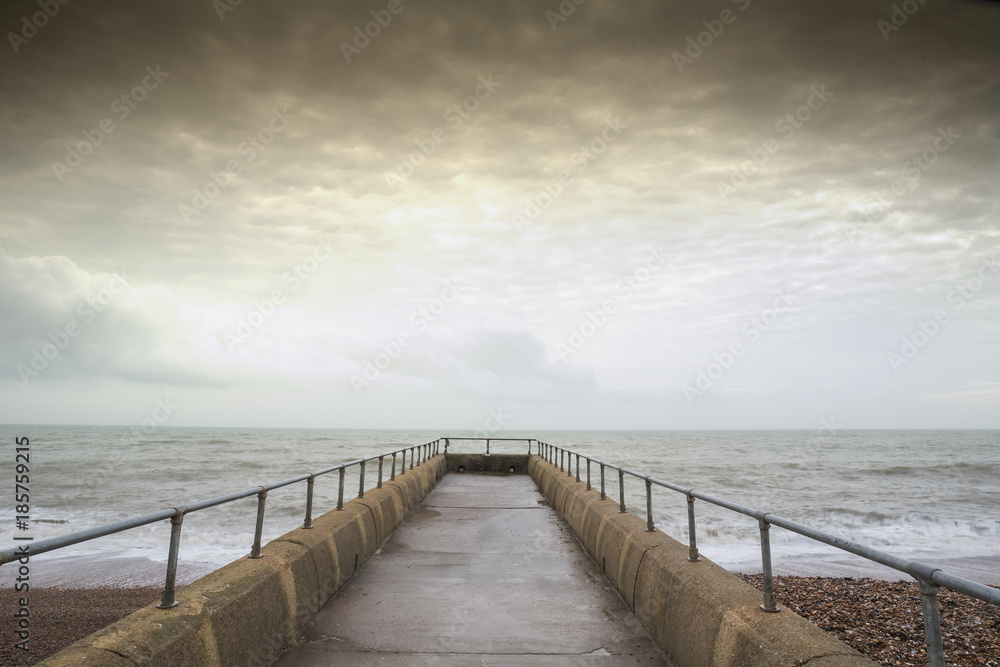 Atmospheric and Moody Long Exposure Photograph of Stone Pier at Brighton, East Sussex, England, UK with copy space