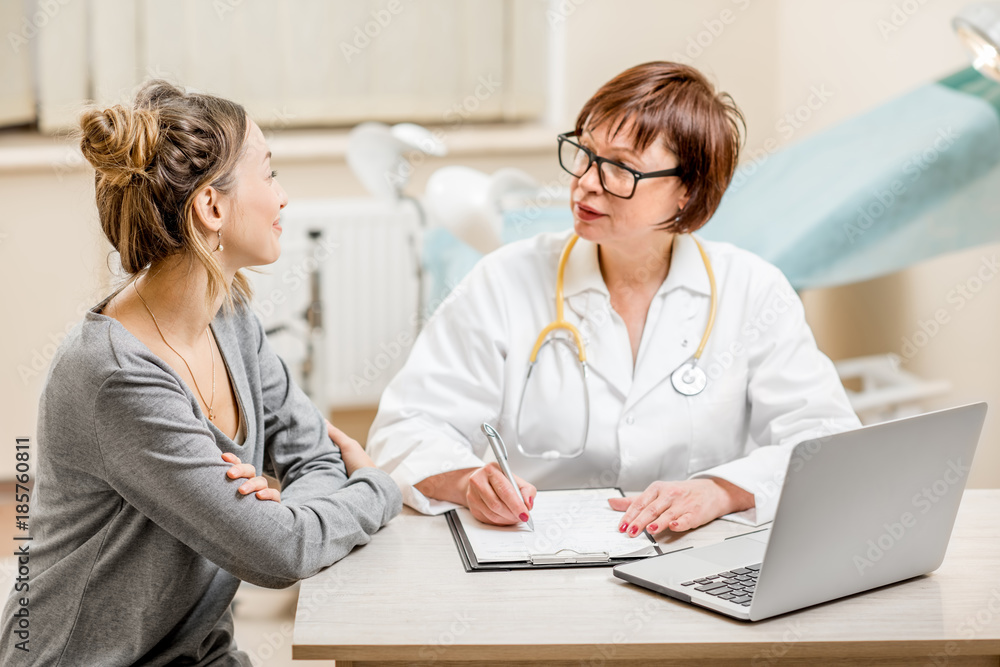 Obraz premium Young woman patient with a senior gynecologist during the consultation in the office
