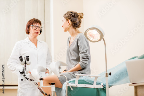 Young woman patient with a senior gynecologist during the consultation in the gynecological office