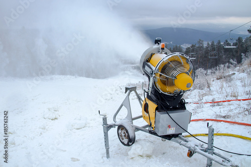 Machine gun for the production of artificial snow in the winter mountains, prepare for ski activities