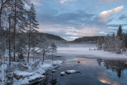 The cold snow winter lake in evening light © Terje