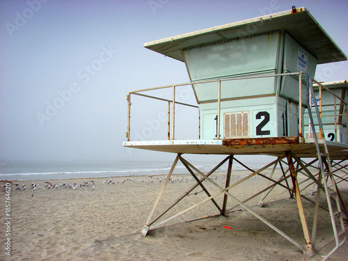 aged and worn lifeguard stand on beach