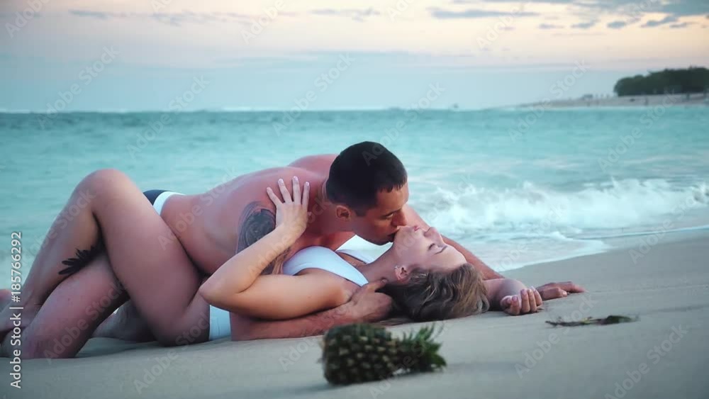 Erotic couple at the beach, sea view. Traveling at Bali. Erotic couple at the beach, sea view. Traveling at Bali.