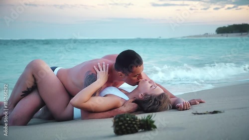 Erotic couple at the beach, sea view. Traveling at Bali.