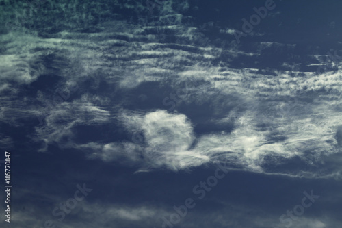 Clouds formate a man stretching out his left arm and saluting with his right arm