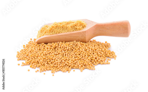 mustard seeds and mustard powder on white background