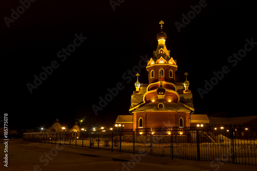 Orthodox church in Siberia before Christmas at night