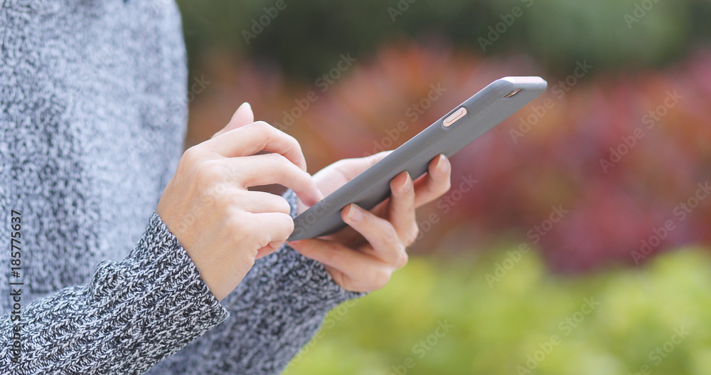 Woman hold with cellphone at outdoor