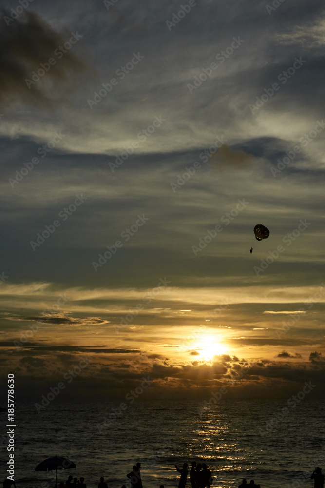 Sunset at sea. Parachute. Free flight Sunset at sea. Parachute. Free flight