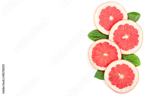 Fototapeta Naklejka Na Ścianę i Meble -  Grapefruit slices with leaves isolated on white background with copy space for your text. Top view. Flat lay pattern