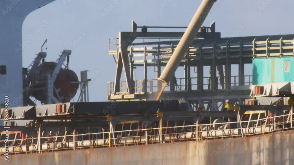 workers at port lincoln supervise the loading of wheat for export onto a ship workers at port lincoln supervise the loading of wheat for export onto a ship