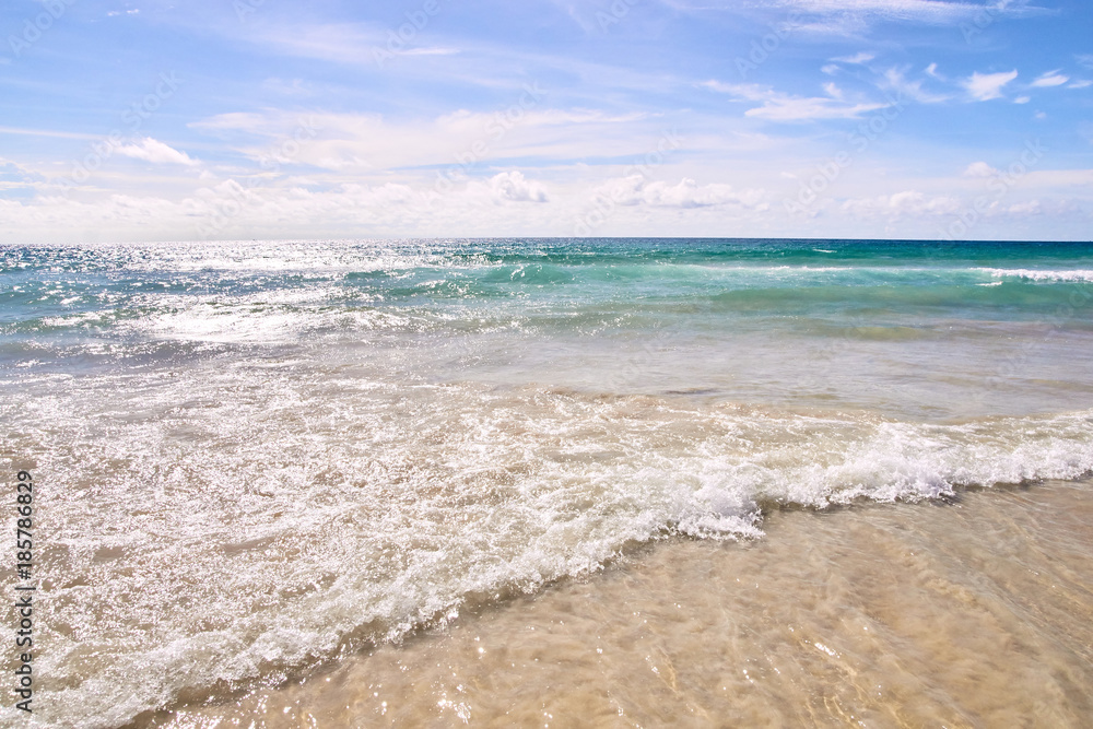 Blue water. Sea waves. White clouds